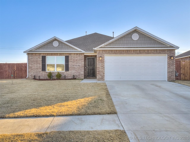 ranch-style home with a garage and a front lawn