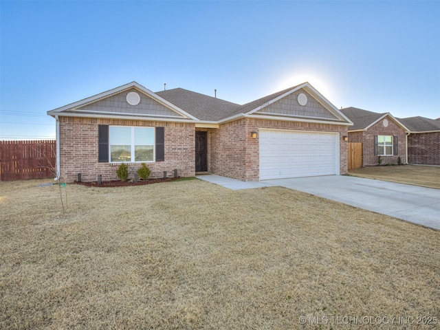 ranch-style home featuring a garage and a front lawn