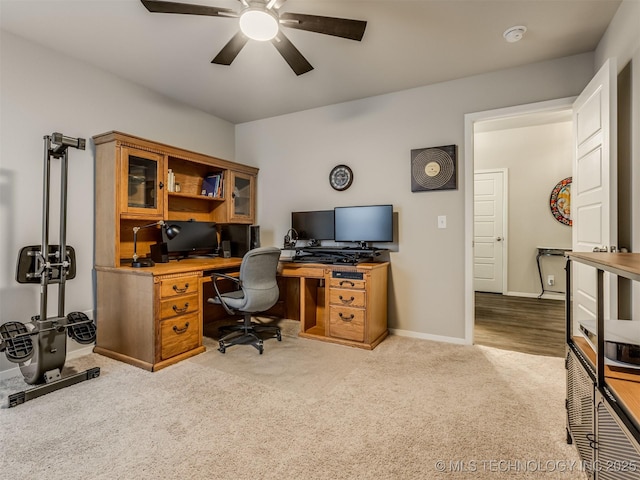 office space with light colored carpet and ceiling fan