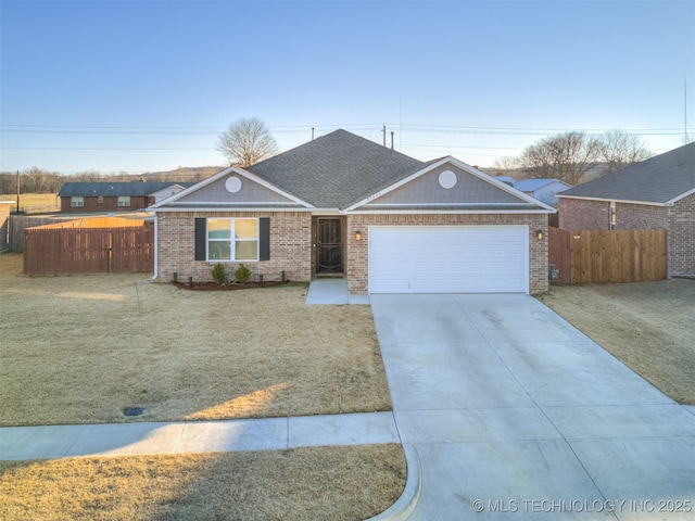 single story home featuring a garage and a front lawn