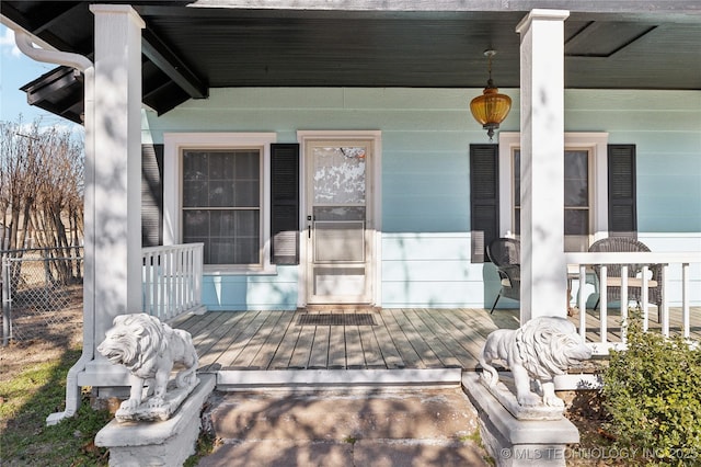 view of exterior entry with covered porch