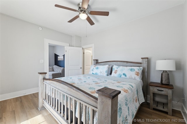 bedroom featuring wood-type flooring and ceiling fan