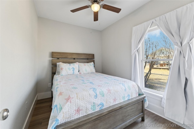 bedroom featuring dark hardwood / wood-style flooring and ceiling fan