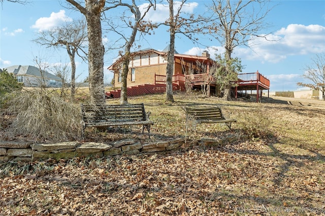 view of yard with a wooden deck