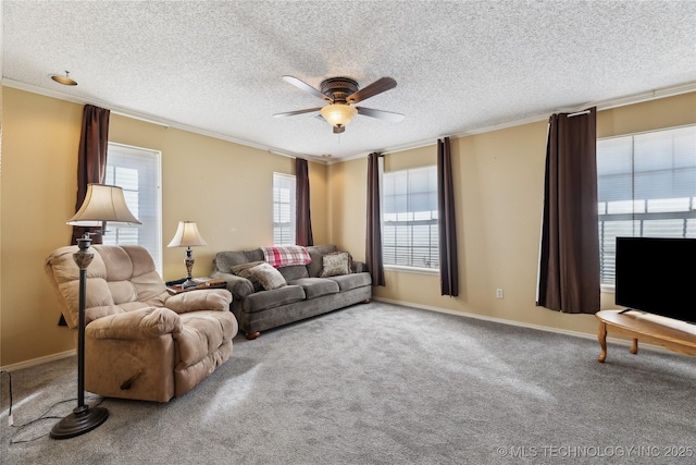 carpeted living room featuring ornamental molding, ceiling fan, and a textured ceiling