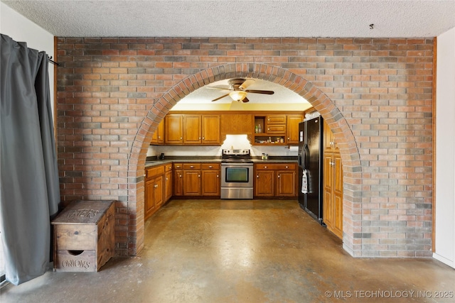 kitchen featuring brick wall, electric range, ceiling fan, black fridge with ice dispenser, and a textured ceiling