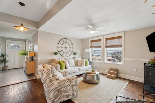 living room with hardwood / wood-style flooring and ceiling fan