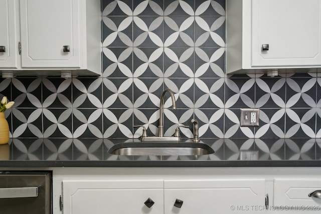 details featuring white cabinetry and wet bar