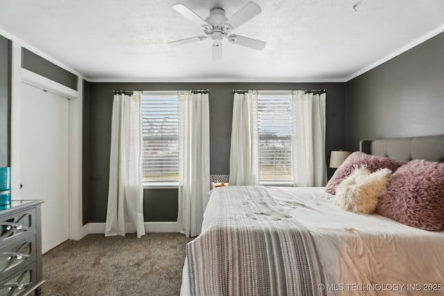 carpeted bedroom with multiple windows, a textured ceiling, and ceiling fan