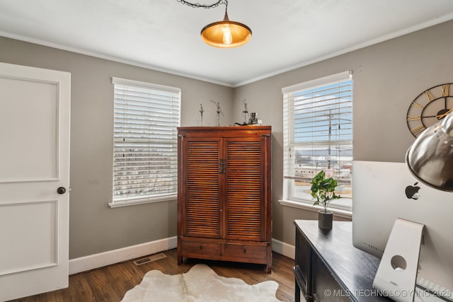 office area featuring ornamental molding and dark hardwood / wood-style flooring