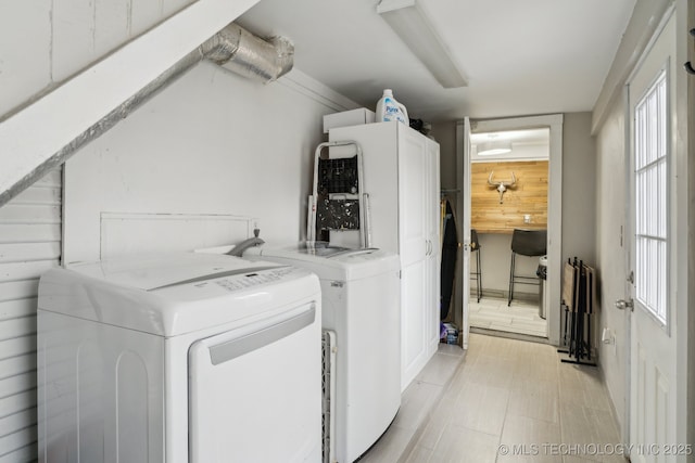 washroom featuring washer and clothes dryer