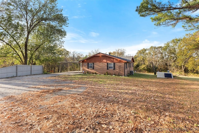 view of side of property featuring a carport