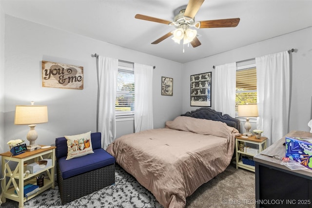 bedroom with ceiling fan and carpet floors