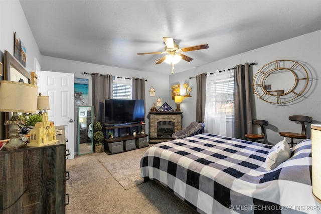 bedroom featuring ceiling fan and carpet flooring