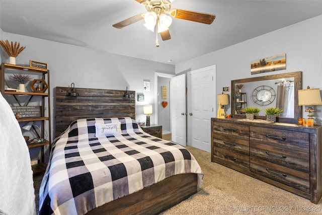 bedroom with light colored carpet and ceiling fan