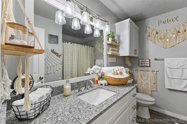 bathroom with hardwood / wood-style flooring, vanity, toilet, and a shower with shower curtain