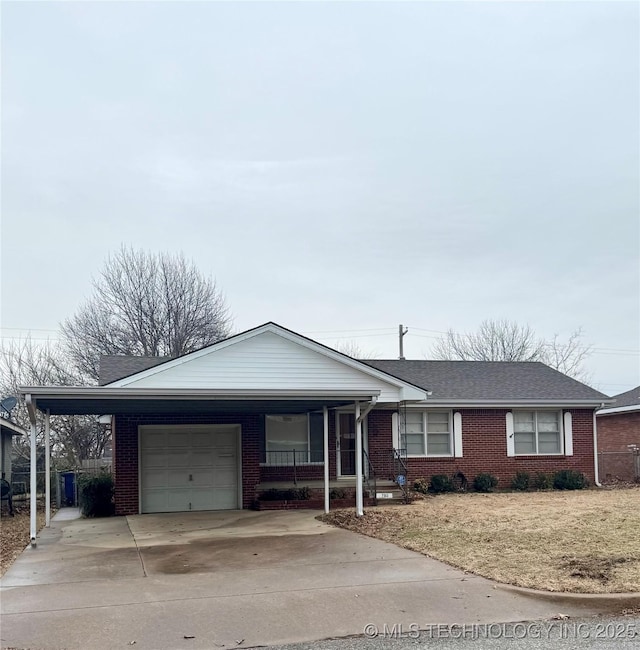 ranch-style home featuring a carport, a garage, covered porch, and a front lawn