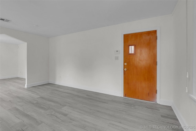 unfurnished room featuring light hardwood / wood-style floors