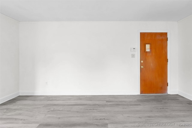 unfurnished room featuring light hardwood / wood-style floors