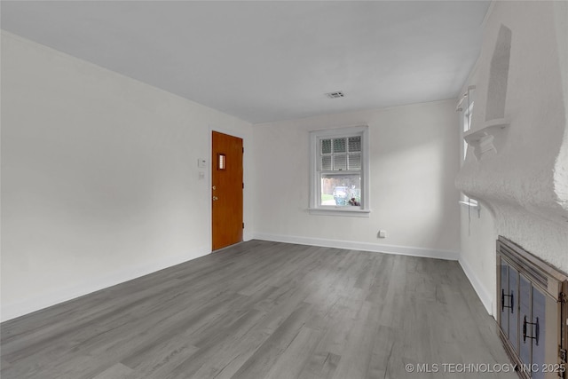 unfurnished living room featuring light hardwood / wood-style floors