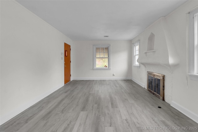 unfurnished living room featuring light hardwood / wood-style floors