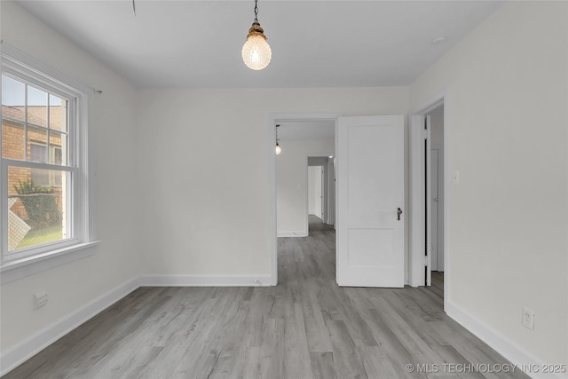 unfurnished room featuring light hardwood / wood-style floors