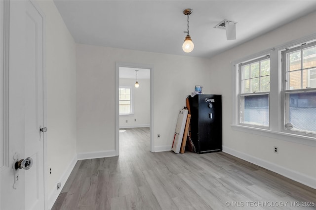 unfurnished room featuring light hardwood / wood-style flooring