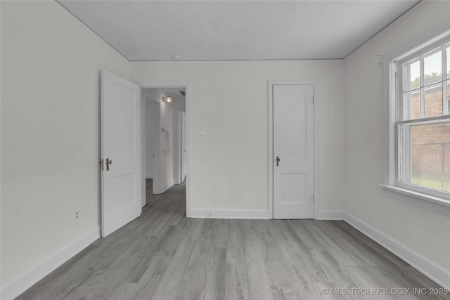 unfurnished room with light hardwood / wood-style floors