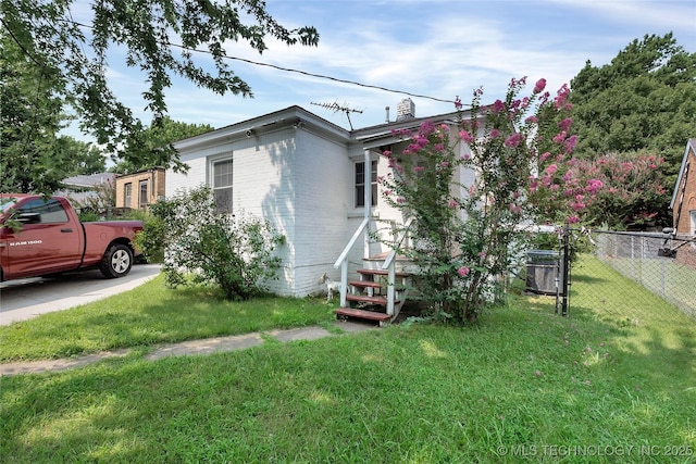 view of property exterior with a yard