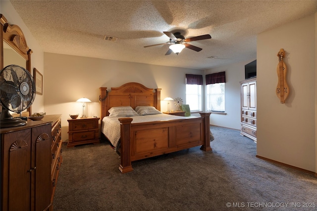 bedroom featuring ceiling fan, dark carpet, and a textured ceiling