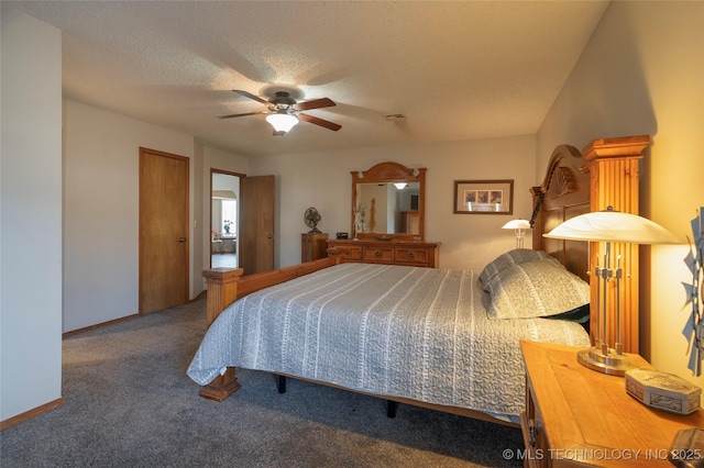 carpeted bedroom featuring ceiling fan and a textured ceiling