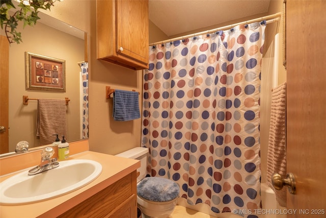 bathroom with vanity, toilet, and a shower with shower curtain