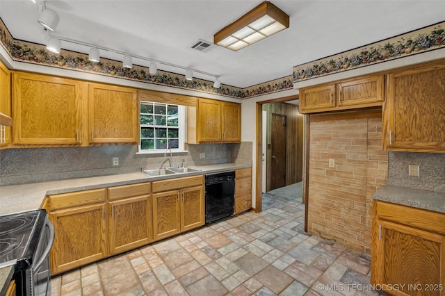 kitchen with decorative backsplash, black dishwasher, sink, and stainless steel range with electric cooktop