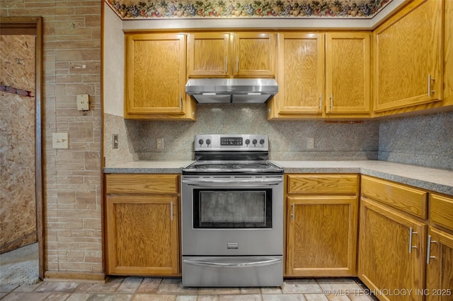 kitchen with tasteful backsplash and stainless steel electric range oven