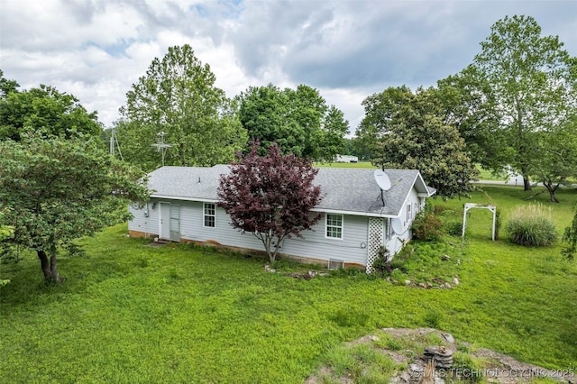 view of property exterior with a lawn