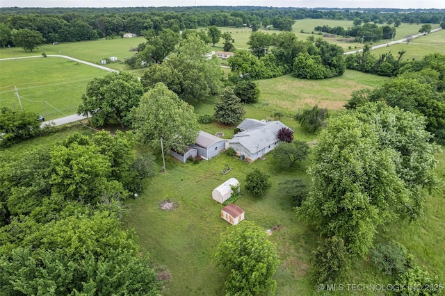 birds eye view of property featuring a rural view