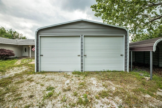 garage featuring a carport