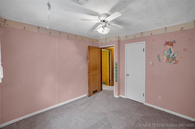 unfurnished room featuring light colored carpet and ceiling fan