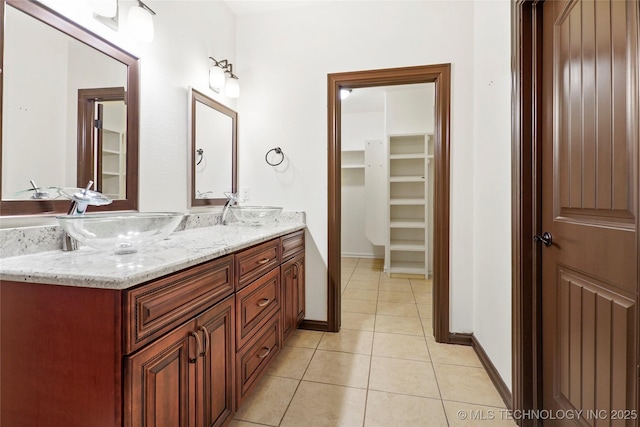 bathroom with tile patterned flooring and vanity