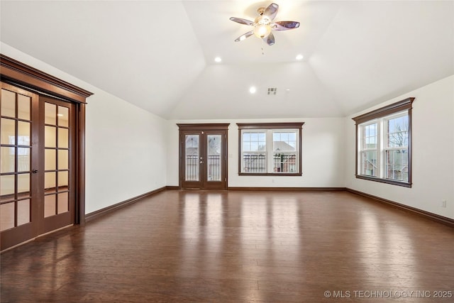 unfurnished living room with french doors, ceiling fan, lofted ceiling, and dark hardwood / wood-style floors