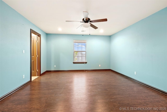 empty room featuring dark hardwood / wood-style floors and ceiling fan