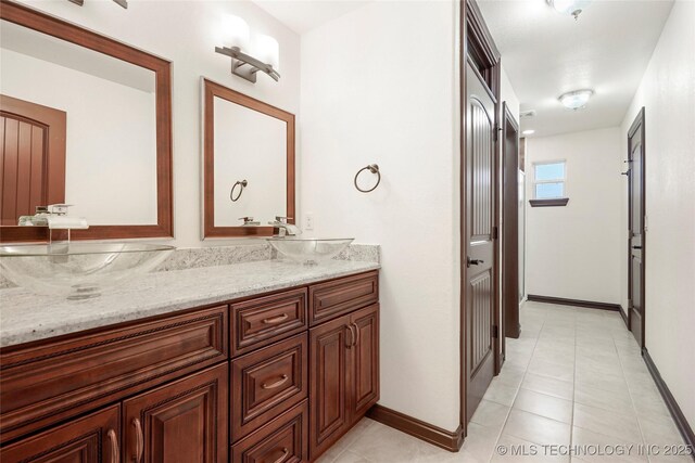 bathroom with vanity and tile patterned flooring