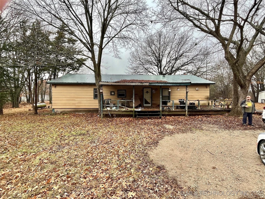 rear view of house with a porch