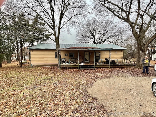 rear view of house with a porch