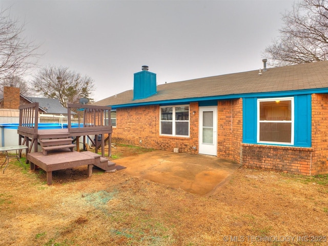 rear view of house with a patio