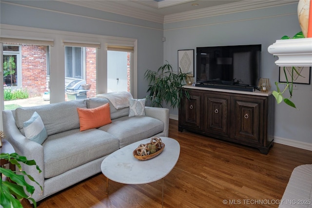 living room with dark wood-type flooring and ornamental molding