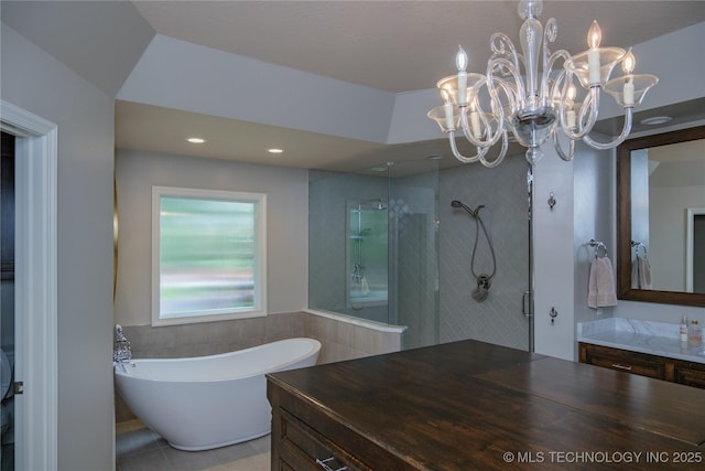 bathroom with vanity, separate shower and tub, and tile walls