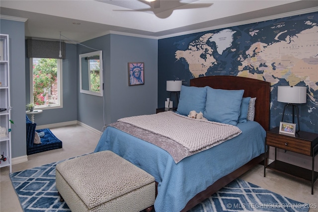 carpeted bedroom with crown molding and ceiling fan