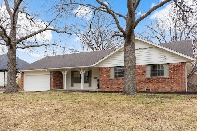 ranch-style house featuring a garage, covered porch, and a front yard