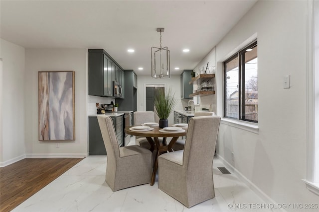 dining space with a chandelier